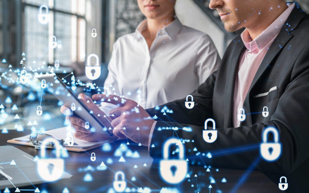 A person’s hand pointing at a screen that reads Cybersecurity